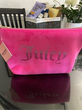 Juicy Couture makeup or accessories bagsNWTs hot pink.. :)